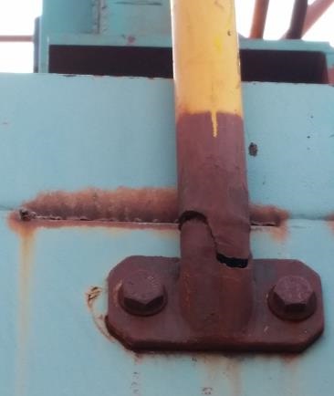 Handrail post failure after inappropriate repair. The corrosion was removed and the area painted without strengthening.