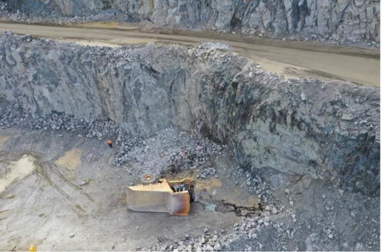 Haul truck breaches windrow