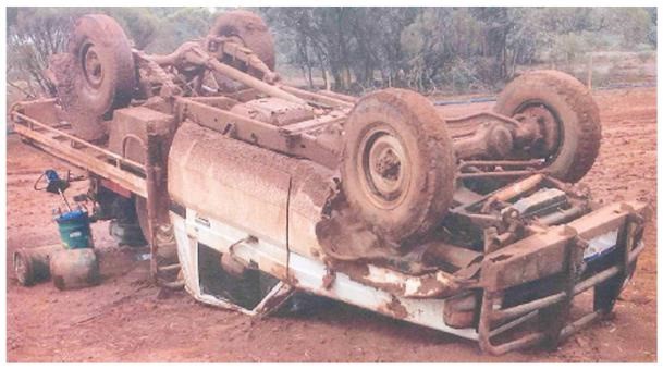 Overturned service vehicle.