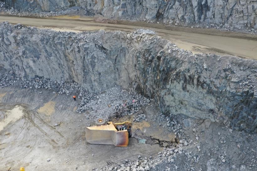 The truck fell 15m over a pit wall.